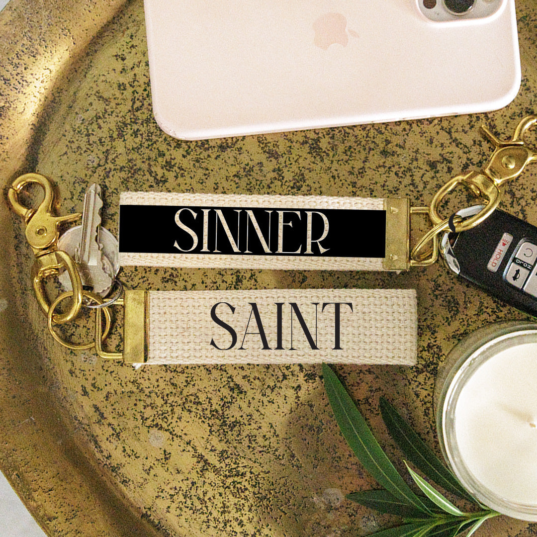 Secret Lives Sinner or Saint Keychain