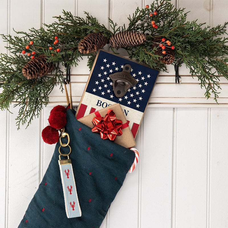 Christmas stocking with a lobster keychain and bottle opener